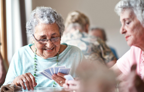 Older People playing a game of cards